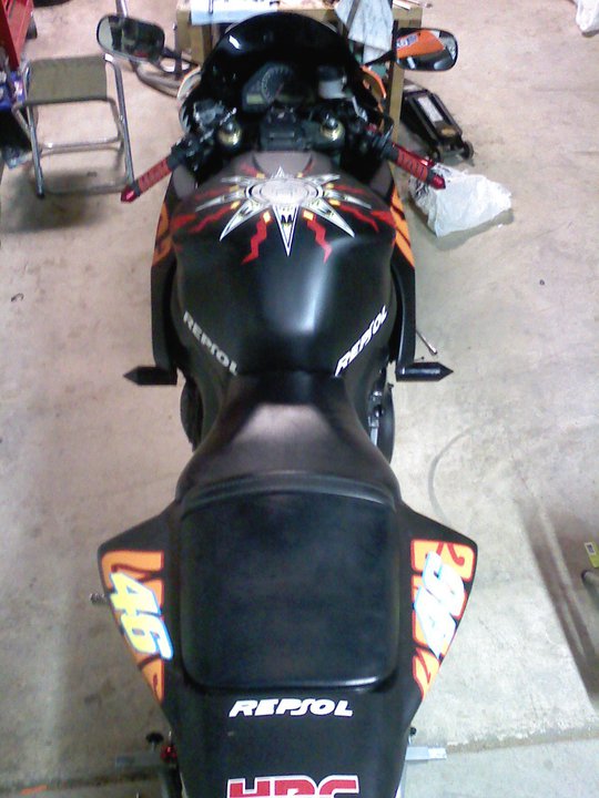 Motorcycle tail section with Repsol livery and number 46
