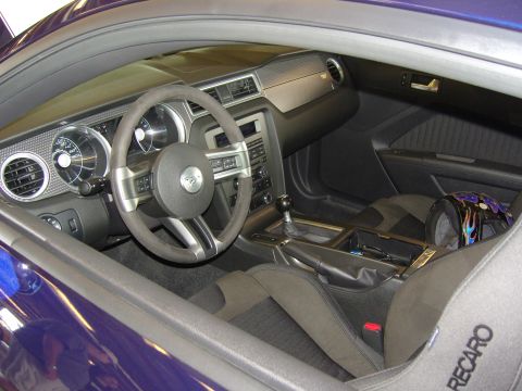 2007 Ford Mustang - Interior view of a car, showing the dashboard, steering wheel, gear shift, and Recaro seats.