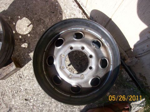 1982 Ford F-100 - Steel truck wheel rim with 8 lug holes, dated 05/26/2011.