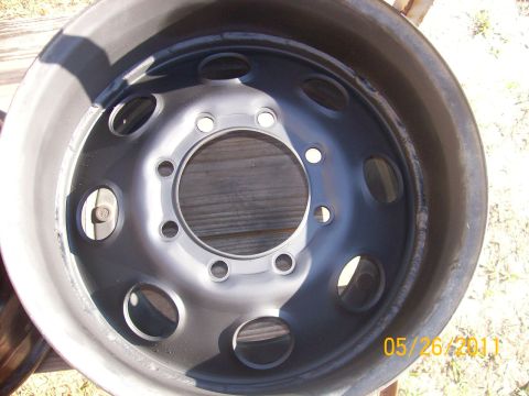 1982 Ford F-100 - Close-up of a steel wheel rim, likely for a truck or heavy equipment.