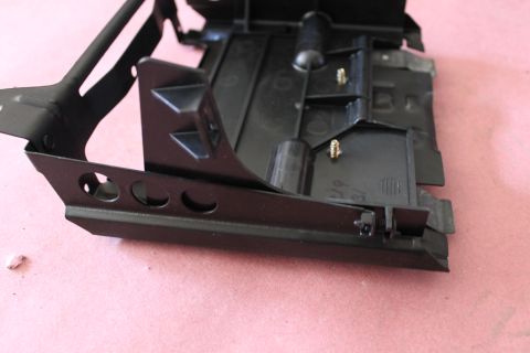 2003 Ford Crown Victoria - Close-up of an unidentified automotive part with visible text and mounting hardware.