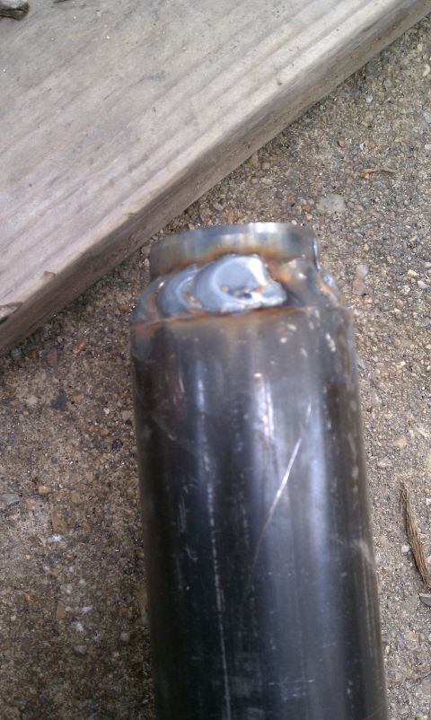 1990 Ford Bronco - Close-up of a welded metal pipe, with the Supermotors.net logo visible at the bottom.