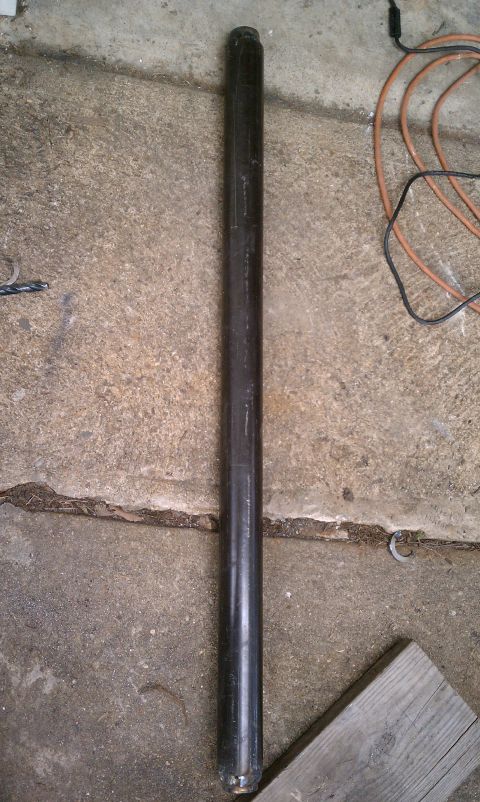 1990 Ford Bronco - A long metal pipe is shown on a concrete surface, possibly a garage floor.