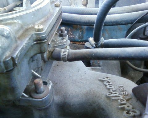 1976 Ford Torino - Close-up of engine components including a Holley carburetor base and an Edelbrock 351 part.