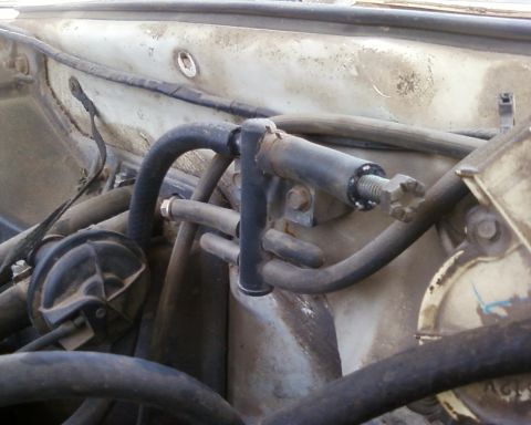 1976 Ford Torino - This photo shows a section of an engine bay with various vacuum lines and a valve assembly.