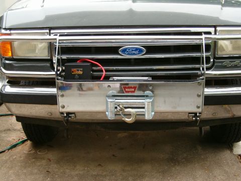 1991 Ford Bronco - The front of a 1991 Ford Bronco is shown, equipped with a winch and brush guard.