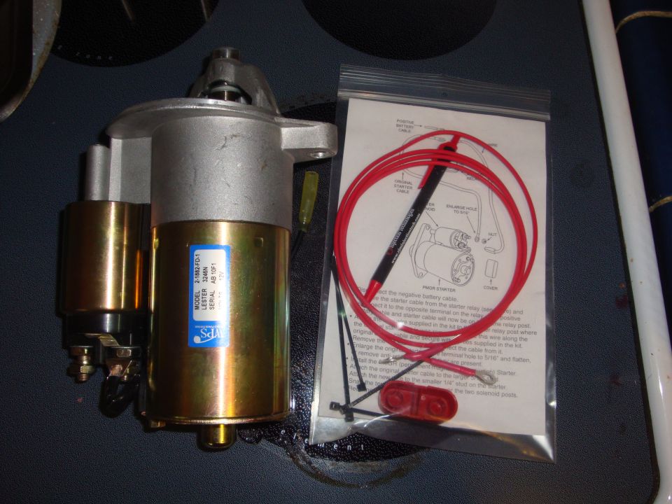 Starter motor with blue label and red wiring kit with instructions