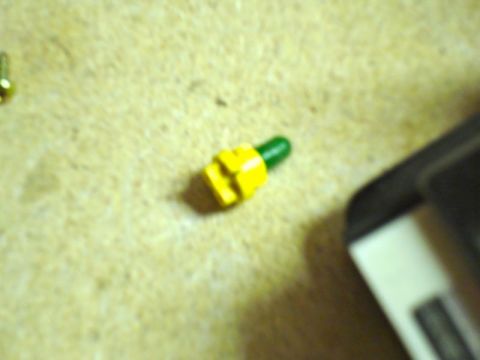 2002 Toyota 4Runner - Close-up of a yellow and green electrical connector, possibly for automotive use.