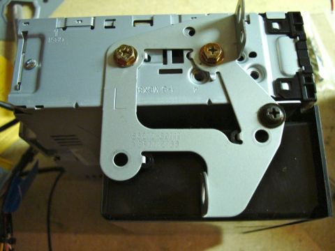 2002 Toyota 4Runner - Close-up of a car stereo mounting bracket with visible screws and part numbers.