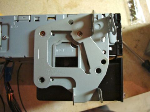 2002 Toyota 4Runner - A car stereo mounting bracket is shown with attached wiring and screws.