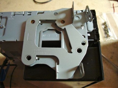 2002 Toyota 4Runner - A metal mounting bracket for a car stereo is shown, with visible part numbers and labels.
