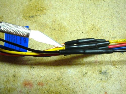2002 Toyota 4Runner - A utility knife is used to strip wires on a harness that is being prepared for a JVC stereo installation.