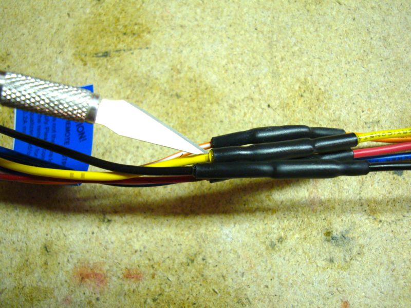 Wire harness with heat shrink tubing and a utility knife