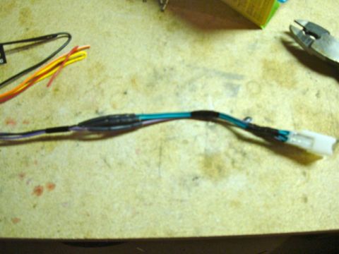 2002 Toyota 4Runner - Wiring harness with a white connector and heat-shrink tubing, likely for car audio installation.