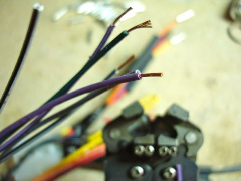 2002 Toyota 4Runner - A crimping tool is shown with various exposed wires, likely for an automotive stereo installation.