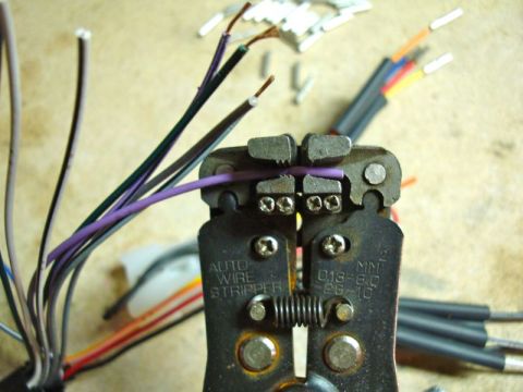 2002 Toyota 4Runner - Close-up of a wire stripper tool working on electrical wires.
