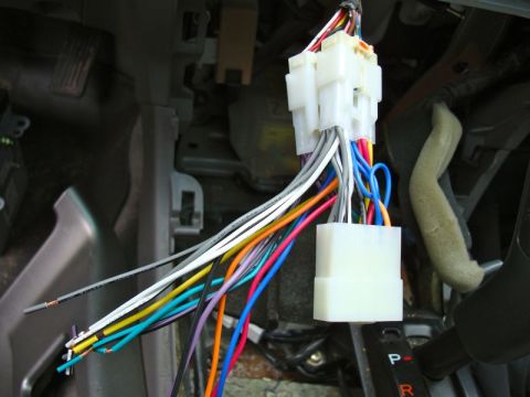 2002 Toyota 4Runner - Close-up of a car's interior wiring harness, showing a tangle of colorful wires and connectors.