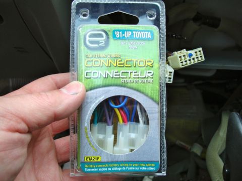 2002 Toyota 4Runner - A hand holds a car stereo wiring connector package for various Toyota models.