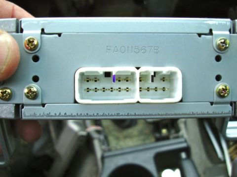 2002 Toyota 4Runner - Close-up of a car stereo's wiring harness connectors and a part number.