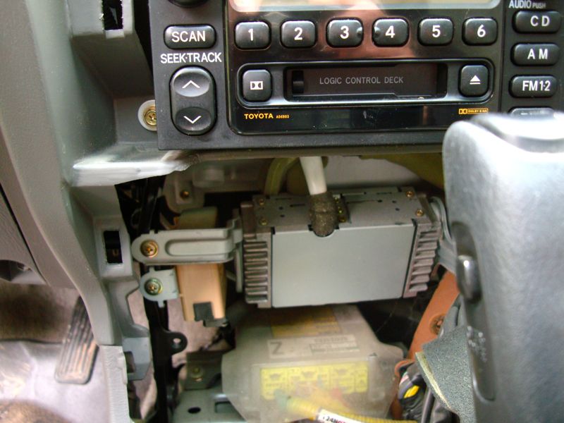 Toyota car stereo with logic control deck and wiring visible