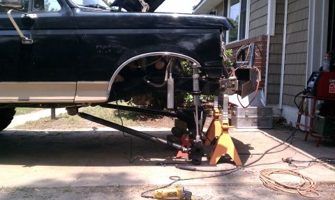 1990 Ford Bronco - This lifted Ford Bronco is being worked on, with its front end elevated on jack stands.