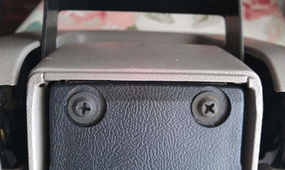 Center console screws on textured plastic panel