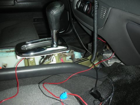 2004 Ford Crown Victoria - The interior of a 2004 Ford Crown Victoria shows exposed wiring and a gear shifter, suggesting modifications.