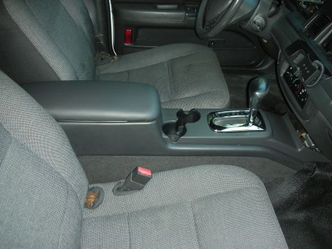 2004 Ford Crown Victoria - Interior view of a 2004 Ford Crown Victoria, focusing on the center console and seating area.