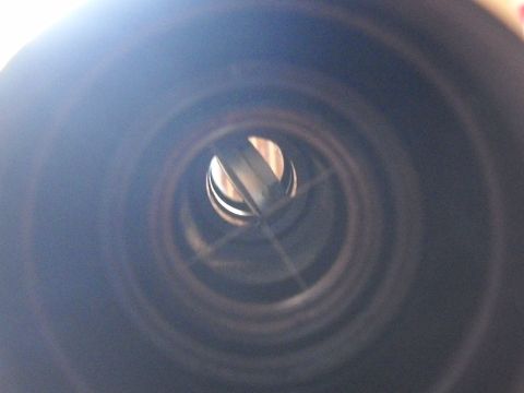 1986 Ford Bronco II - View from inside an exhaust pipe, showing internal baffles or structure.