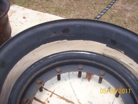 1982 Ford F-100 - A close-up view of a wheel rim shows signs of wear and rust, with visible bolts around the center.