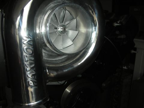 1992 Ford Crown Victoria - Close-up of a polished Paxton supercharger, showing the impeller and intake housing.