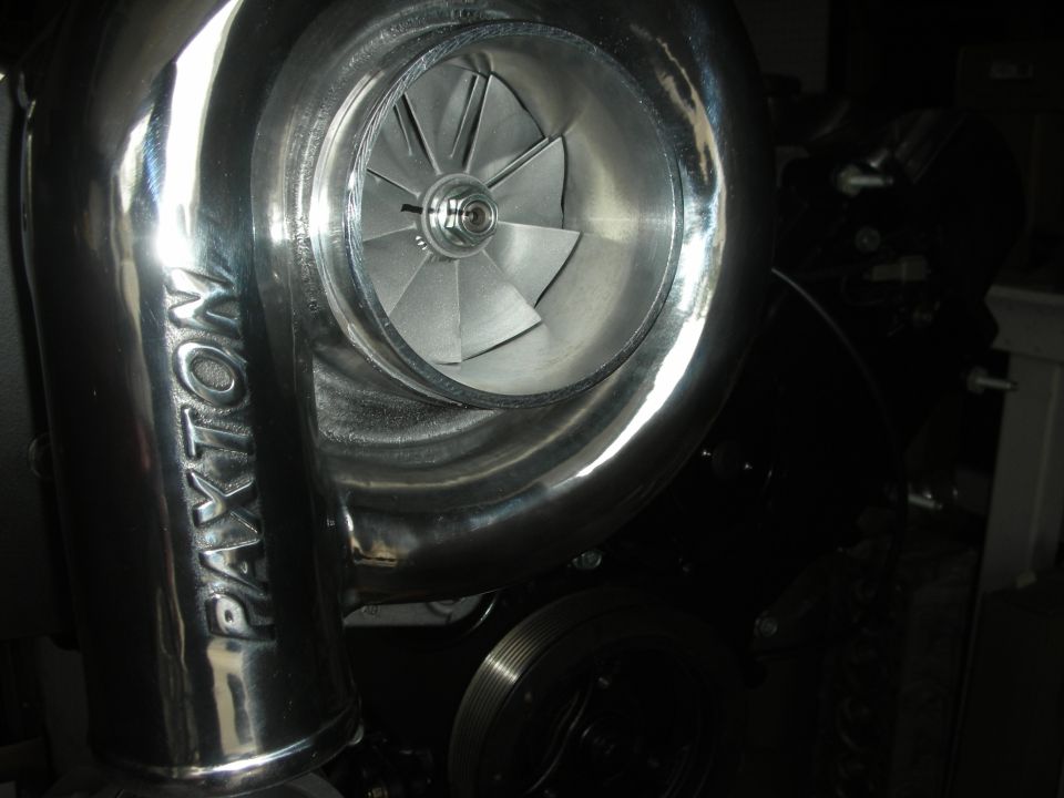 Polished Paxton supercharger with visible impeller