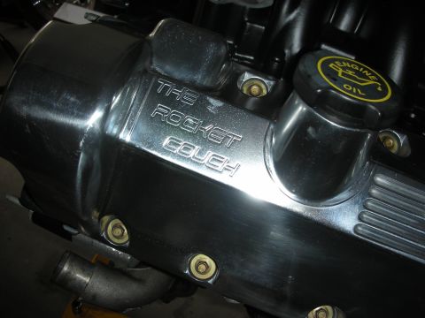 1992 Ford Crown Victoria - Close-up of a custom engine valve cover with engraved text and an engine oil cap.