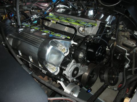 1992 Ford Crown Victoria - Close-up view of an engine compartment polished valve covers and accessory drive components.