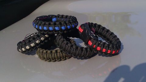 2006 Dodge Charger - Collection of paracord survival bracelets with various color accents and black buckles.