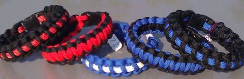 2006 Dodge Charger - A collection of woven paracord bracelets in various color combinations are displayed.
