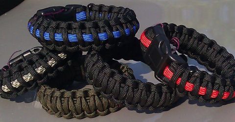 2006 Dodge Charger - Collection of paracord survival bracelets displayed on a surface, various color combinations.