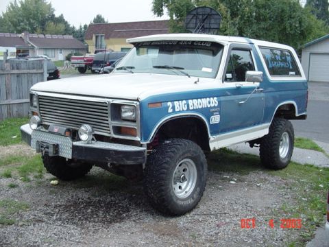 1989 Ford Bronco - This modified Ford Bronco features a custom bumper and "2 BIG BRONCOS" side decal. The year is estimated from its body style.