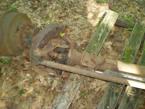 1979 Ford Bronco - This heavily rusted axle assembly is not identifiable to a specific vehicle model or year.
