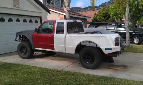 1992 Ford Ranger - This pickup truck appears to be undergoing modifications, with mismatched paint and custom bodywork visible.