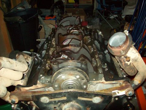 1985 Ford Bronco - Close-up view of an engine block and crankshaft, likely during a rebuild or repair process.
