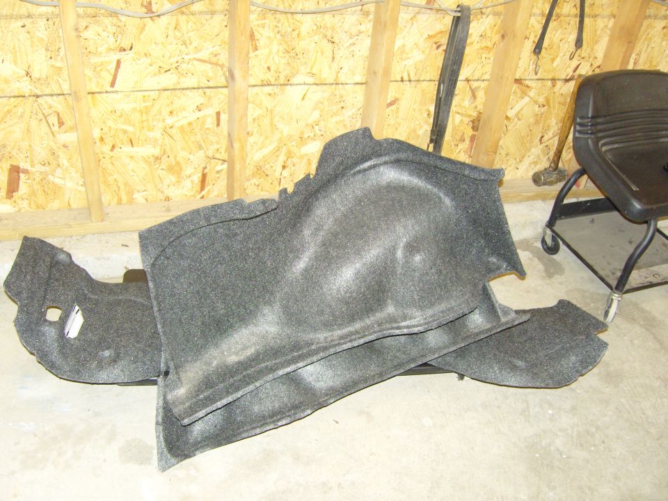 Car trunk liner on concrete floor