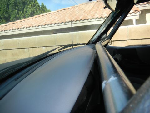 1997 Ford Ranger - Vehicle interior with roll cage and dashboard visible, including a website watermark.