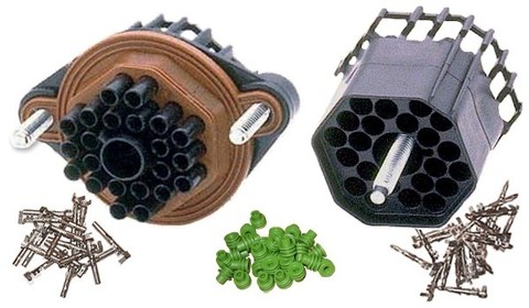 1988 Ford Bronco - A collection of electrical connectors, pins, and seals, likely for automotive use.