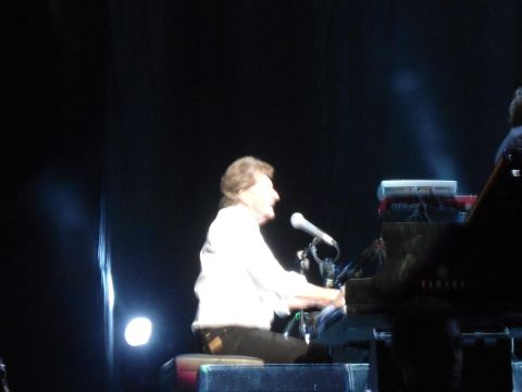 1989 Ford Bronco - A musician performs on a grand piano during a concert.