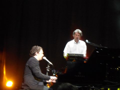 1989 Ford Bronco - Musicians perform live on stage with a grand piano and electronic keyboards.