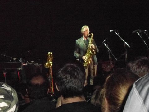 1989 Ford Bronco - A musician performs on stage with a saxophone, accompanied by microphones and other instruments.