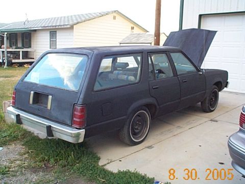 1982 Mercury Zephyr - 1982 Mercury Zephyr wagon parked outside a garage with the hood up.