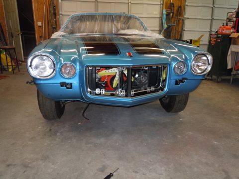 1972 Chevrolet Camaro - Front end of a blue Chevrolet Camaro, likely from the early 1970s, undergoing restoration in a garage.