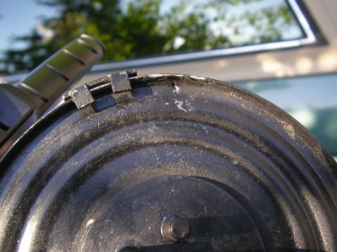 1990 Ford Bronco - Close-up of a vacuum hose and a metal drum, showing signs of age and use.